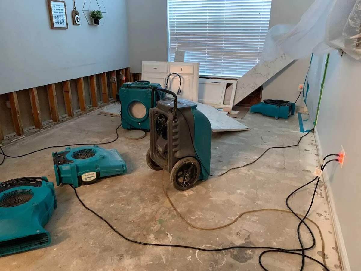 Dehumidifier in flood-cut room for Water Damage Restoration in Belterra